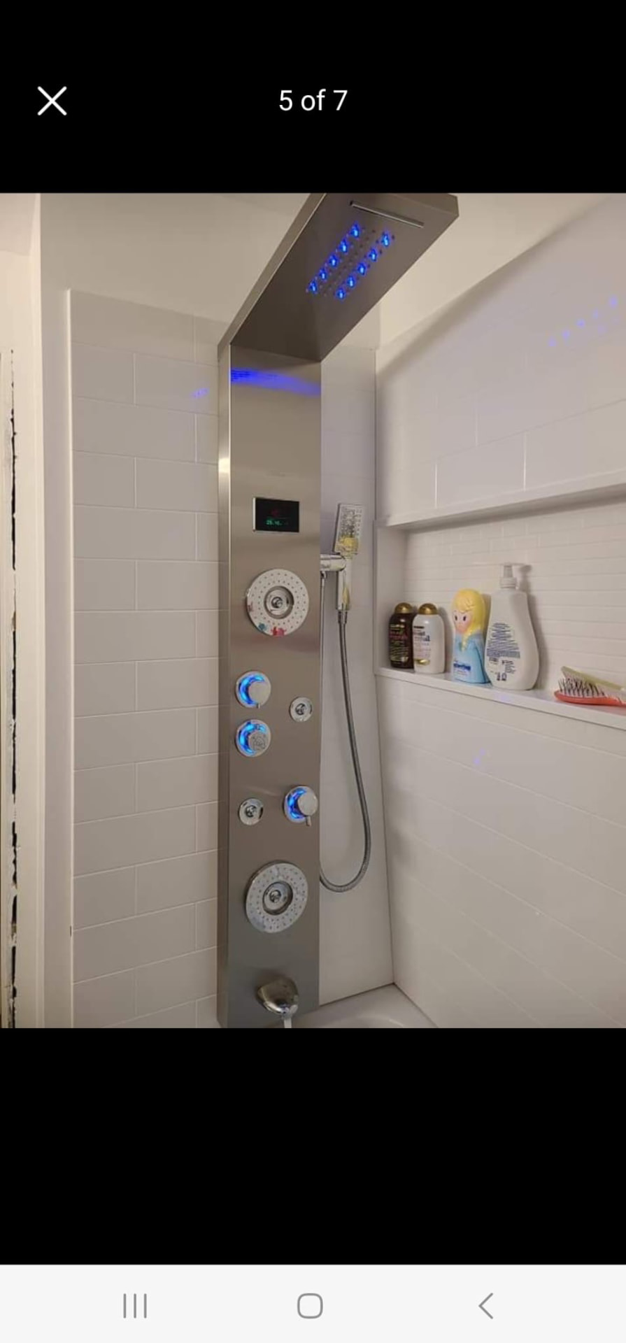 Modern LED rainfall shower panel with body jets and blue accent lighting