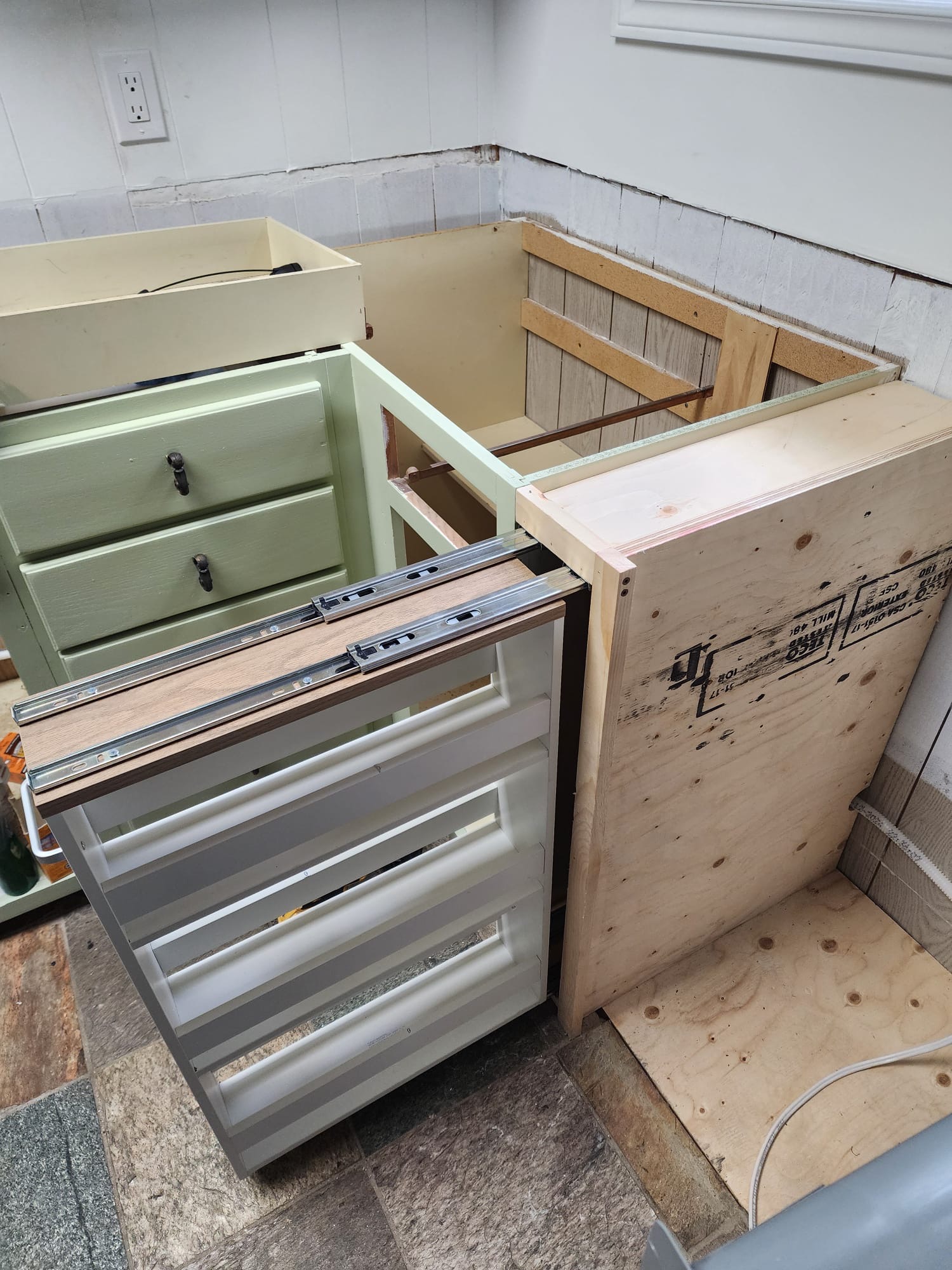 Custom kitchen drawer boxes and cabinet assembly during renovation