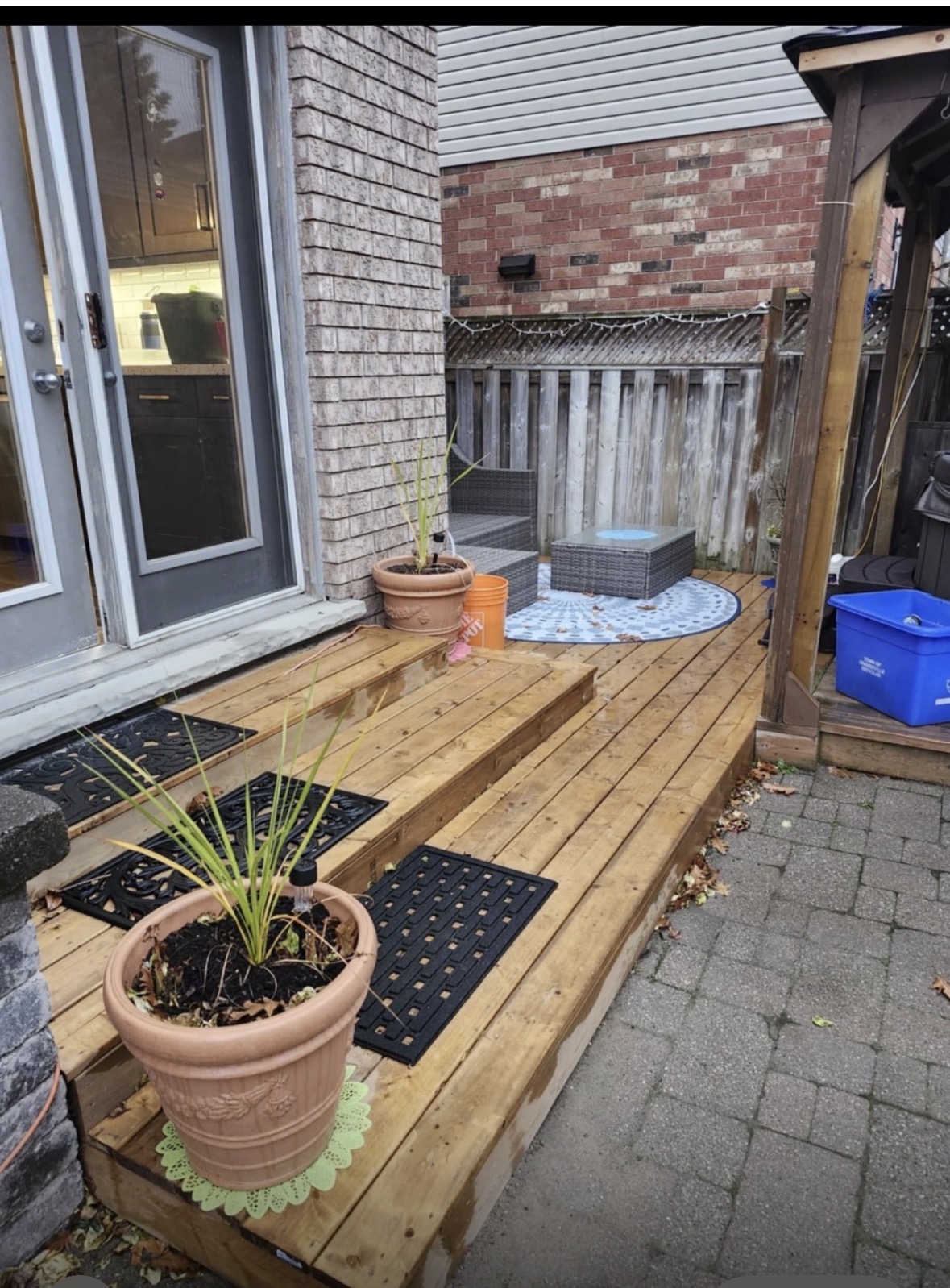 Wooden deck steps from patio door