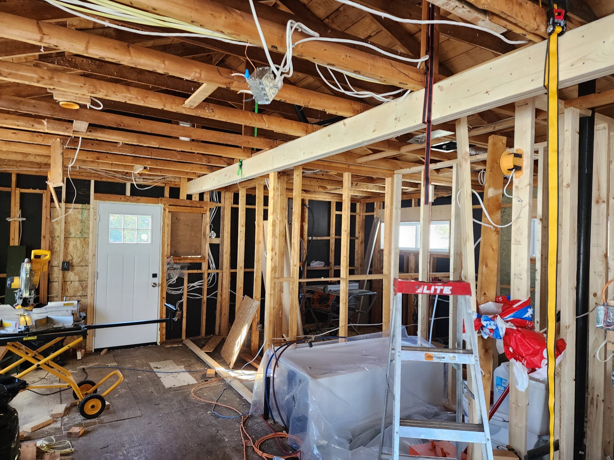 Interior room addition framing with electrical rough-in and new support beam