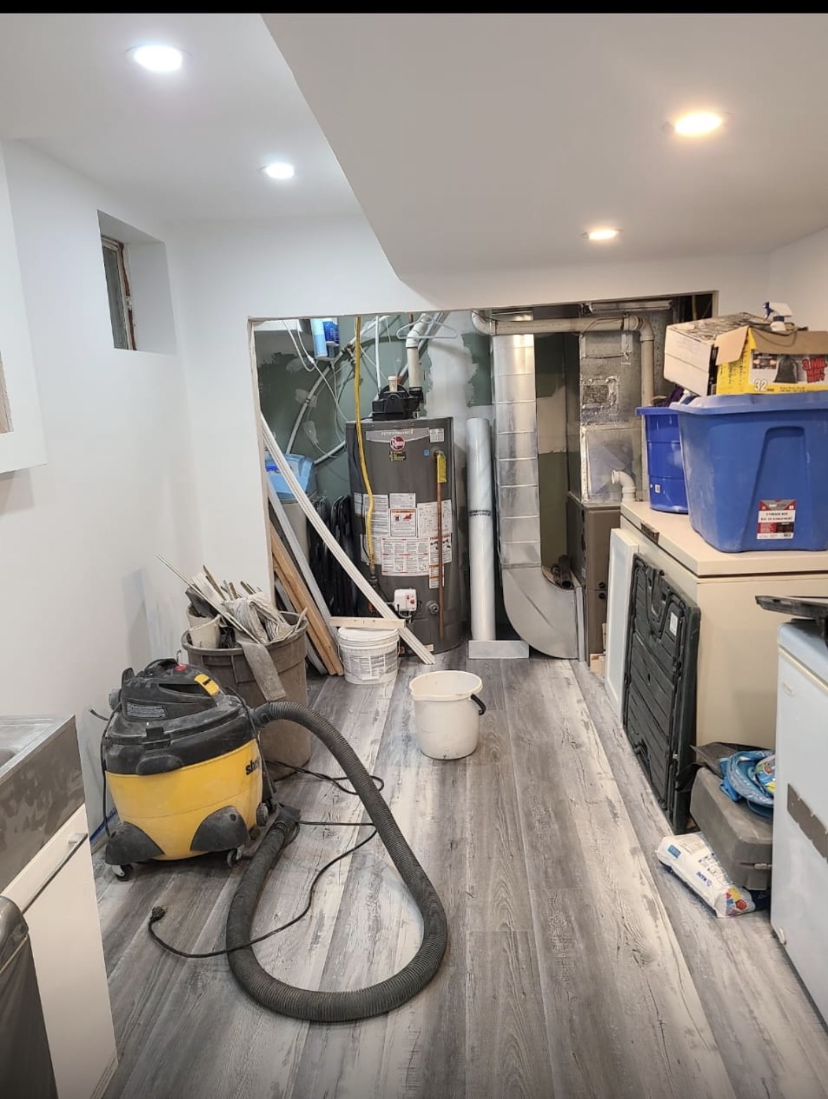 Basement utility room with new flooring