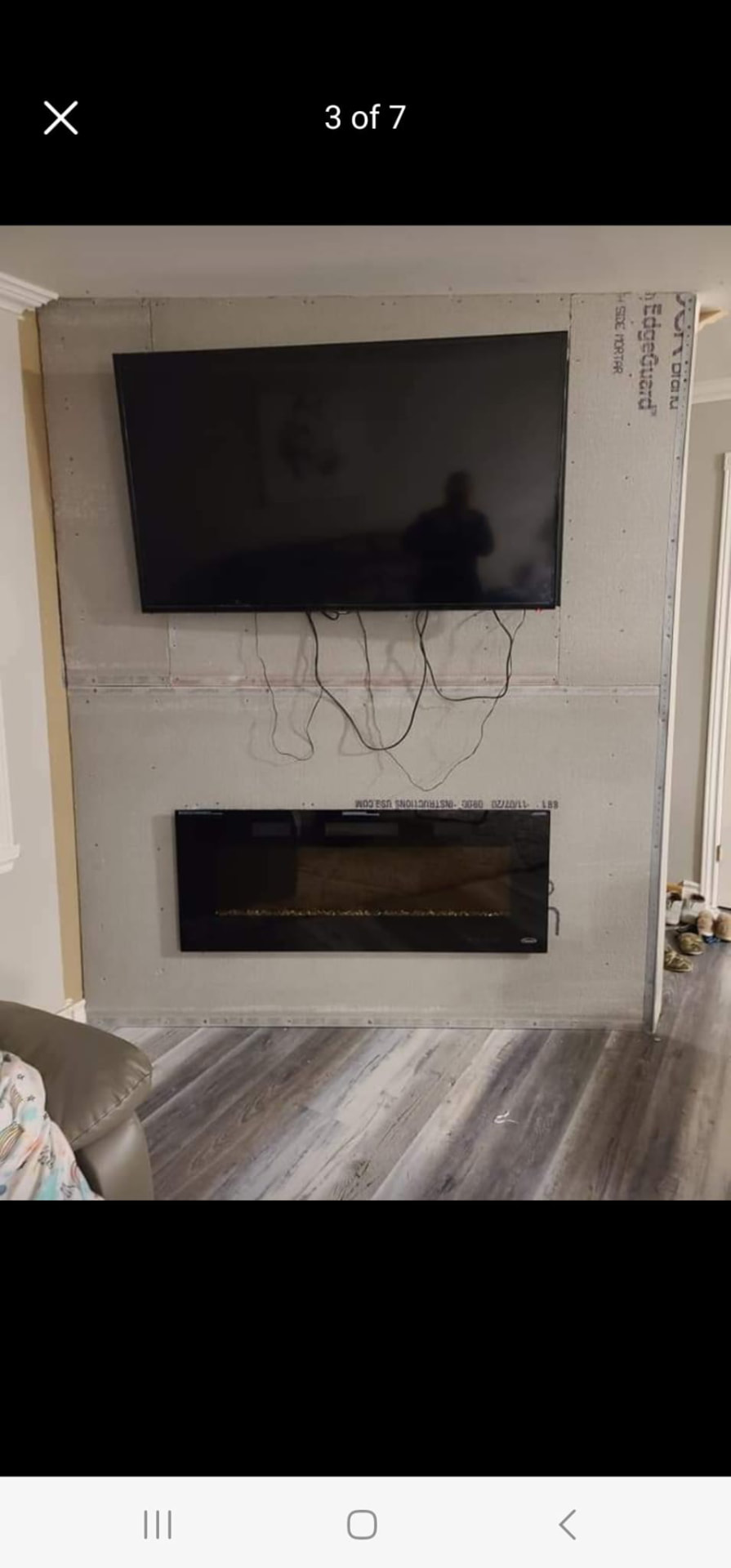 Fireplace and TV feature wall framed and boarded before finishing