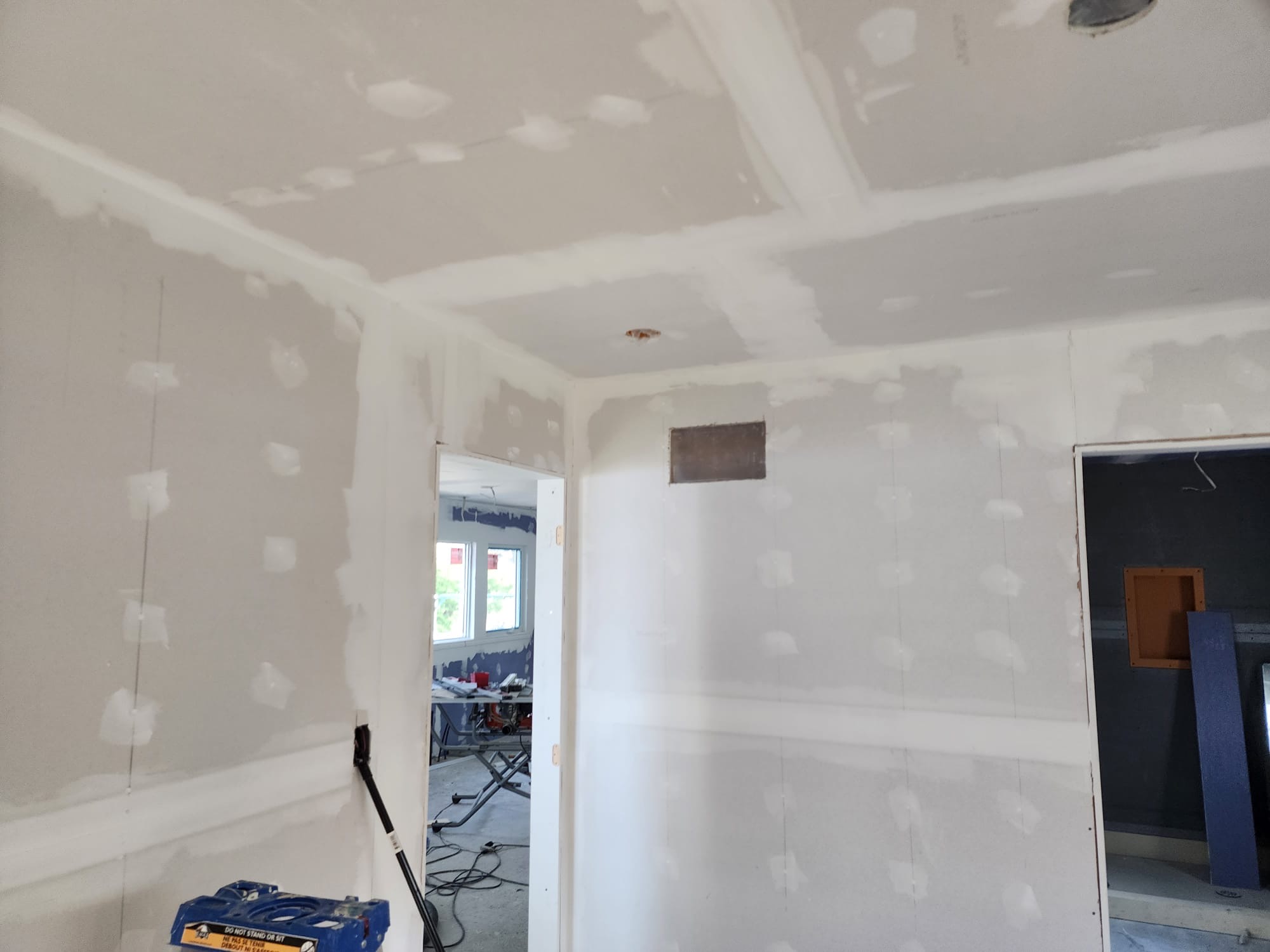 New room addition with drywall installed, taped, and ready for finishing