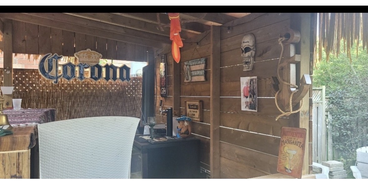 Tiki bar interior with Corona sign